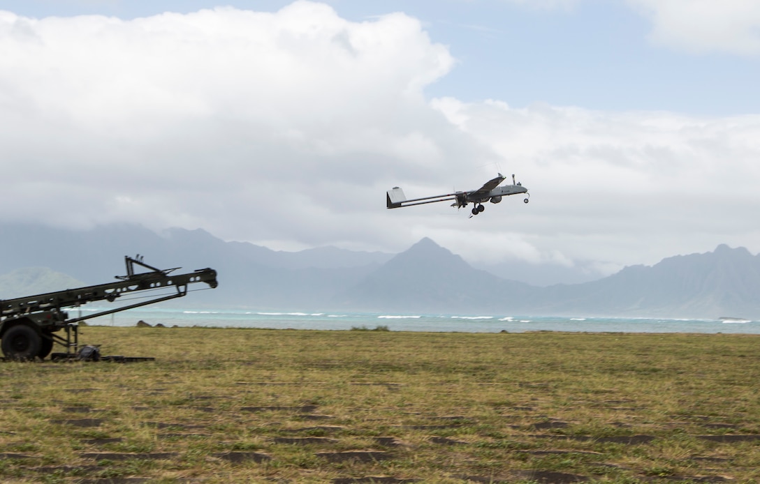 An RQ-7B Shadow unmanned aerial system with Marine Unmanned Aerial Vehicle Squadron 3 (VMU-3), is launched during a training event at Landing Zone Westfield, Marine Corps Air Station Kaneohe Bay, Oct. 13, 2017. The purpose of the event is to conduct UAS operations with a minimal amount of personnel and equipment after flying a system in by KC-130J in order to operate immediately within a short amount of time. (U.S. Marine Corps photo by Lance Cpl. Isabelo Tabanguil)