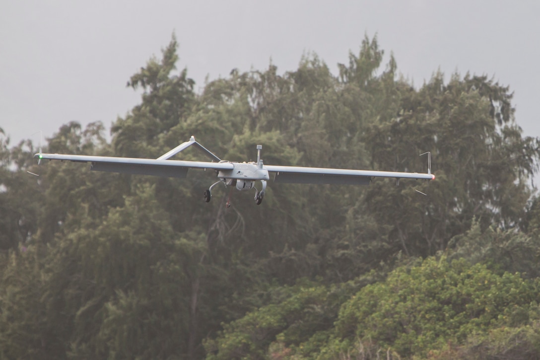 An RQ-7B Shadow unmanned aerial system with Marine Unmanned Aerial Vehicle Squadron 3 (VMU-3) , conducts a landing approach during a training event at Landing Zone Westfield, Marine Corps Air Station Kaneohe Bay, Oct. 18, 2017. The purpose of the event is to conduct UAS operations with a minimal amount of personnel and equipment after flying a system in by KC-130J in order to operate immediately within a short amount of time. (U.S. Marine Corps photo by Lance Cpl. Isabelo Tabanguil)
