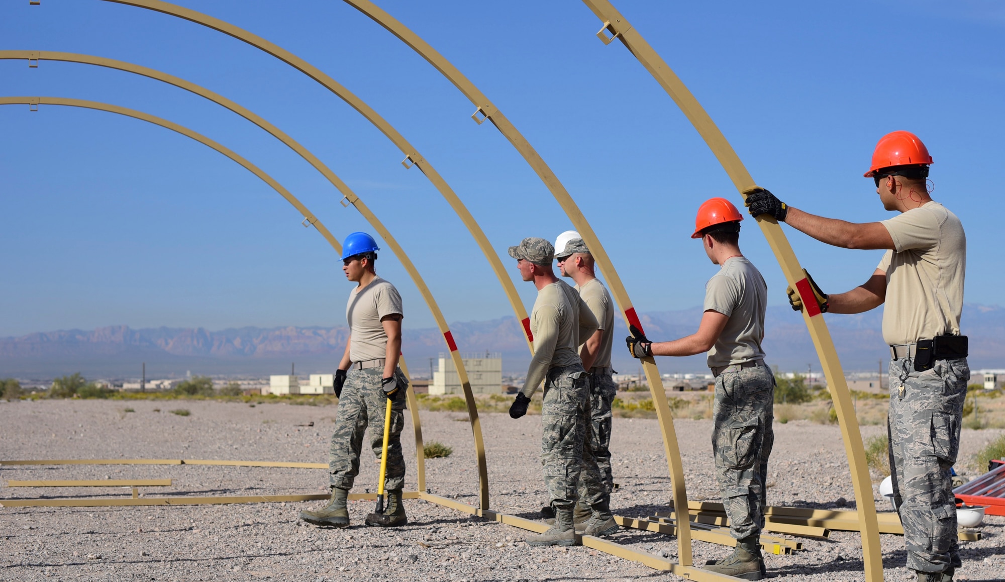 99th Civil Engineer Squadron structural engineers build a field tent during a base emergency engineer force training exercise at Nellis Air Force Base, Nevada, Oct. 19, 2017. Field tents provide shelter and storage for personnel and equipment in deployed locations. (U.S. Air Force photo by Airman 1st Class Andrew D. Sarver/Released)