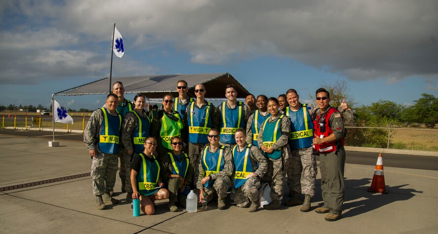 Members from the 15th Medical Group pose for a photo prior to the start of the 2017 Triennial Emergency Response Exercise at the Daniel K. Inouye International Airport, Honolulu, Hawaii, Oct. 20, 2017.