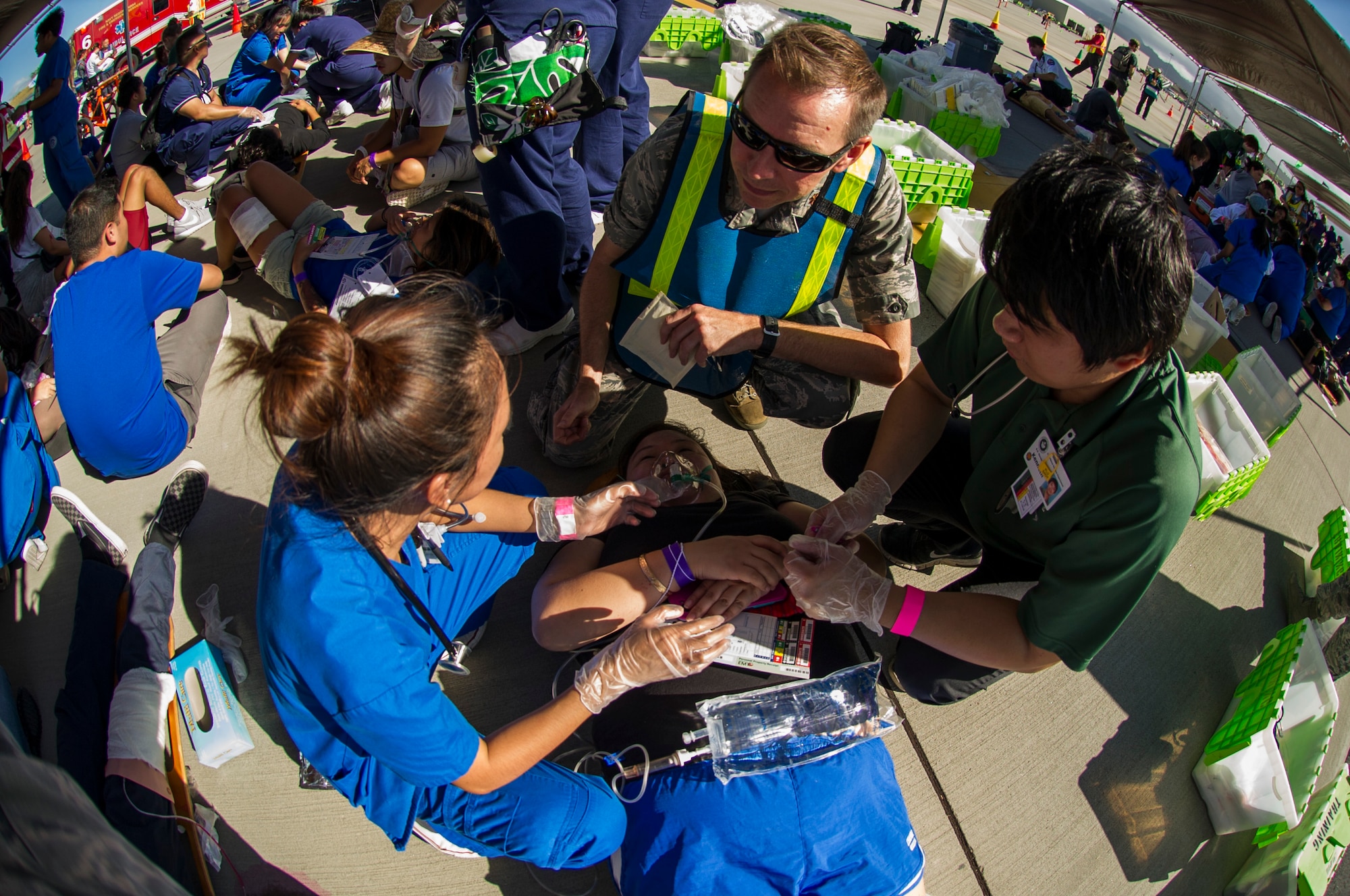 Maj. Samuel Millar, 15th Medical Group flight medicine and optometry commander, instructs nursing students on triage procedures during the 2017 Triennial Emergency Response Exercise at the Daniel K. Inouye International Airport, Honolulu, Hawaii, Oct. 20, 2017.