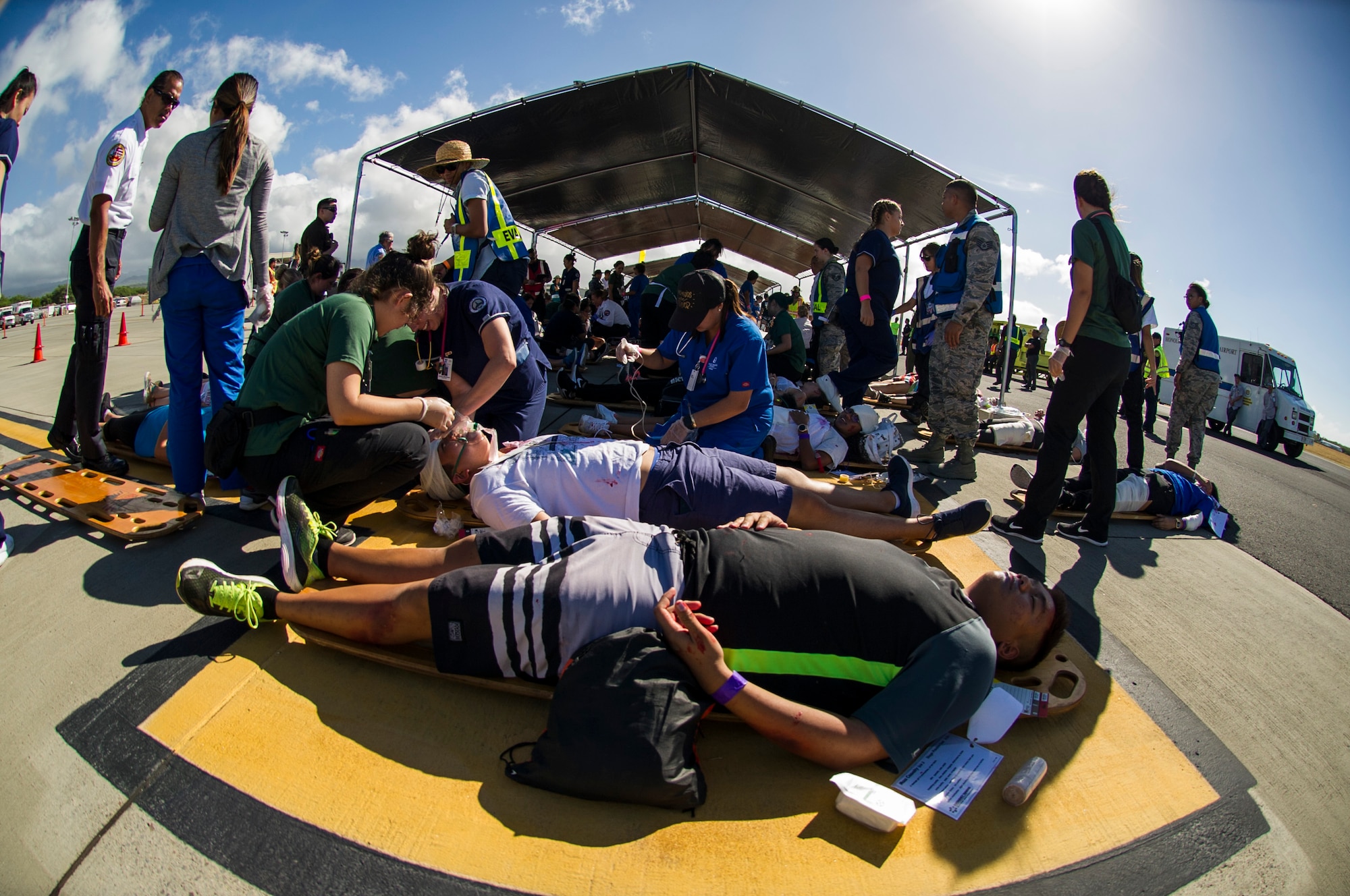 Volunteers are sorted and await treatment for their simulated injuries during the 2017 Triennial Emergency Response Exercise at the Daniel K. Inouye International Airport, Honolulu, Hawaii, Oct. 20, 2017.