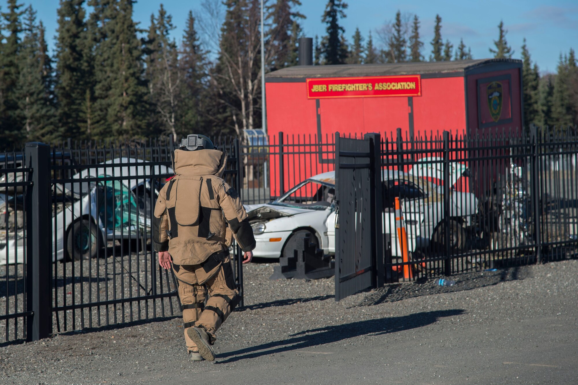 Air Force Staff Sgt. Zacheriah Sekula, 673d Civil Engineer Squadron explosive ordnance disposal team leader, examines a training vehicle-borne improvised explosive device during a Mission Assurance Exercise at Joint Base Elmendorf-Richardson, Alaska, Oct. 17, 2017. The MAE was an anti-terrorism force protection exercise that simulated a threat against the base.