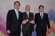 Defense leaders pose for a friendly photo.