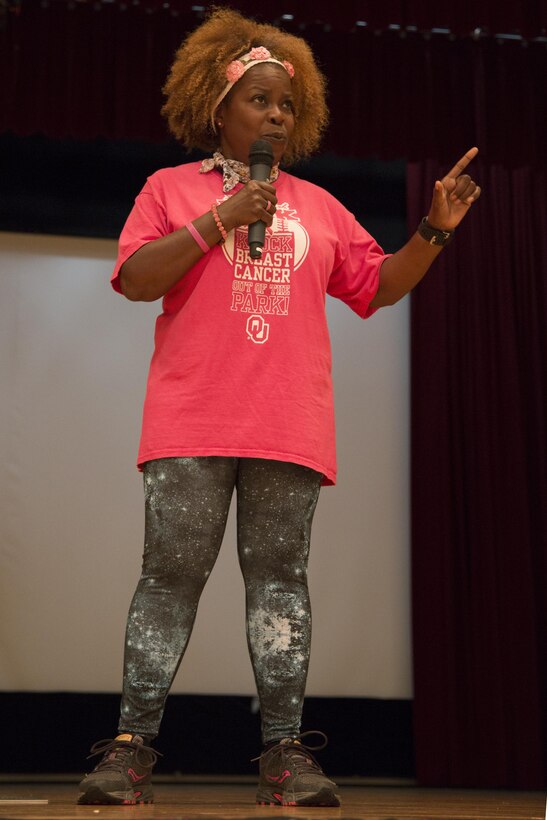 CAMP FOSTER, OKINAWA, Japan – Saundra Ladd speaks about her battle with breast cancer at the Breast Cancer Awareness Zumbathon Oct. 20 at the Community Center aboard Camp Foster, Okinawa, Japan.