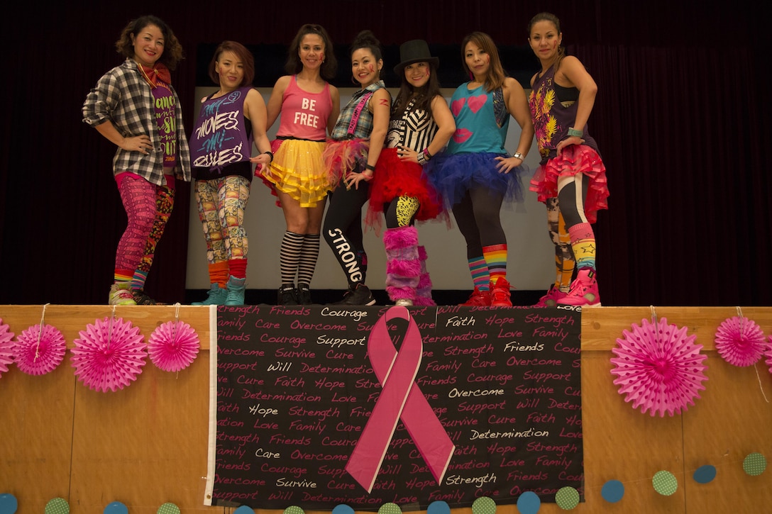 CAMP FOSTER, OKINAWA, Japan – Zumba instructors pose during the Breast Cancer Awareness Zumbathon Oct. 20 in the Community Center aboard Camp Foster, Okinawa, Japan.