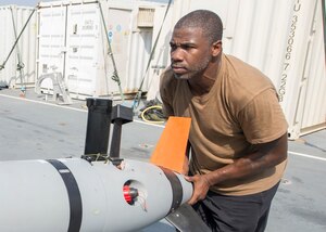 Aerographer’s Mate 1st Class Jamaine Parks, assigned to Task Group 56.1 moves an MK 18 Mod 2 unmanned underwater vehicle aboard Royal Fleet Auxiliary landing ship dock RFA Cardigan Bay (L3009) during Mine Identification and Exploitation Exercise (MIE-EX) 2017.