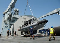 Members of the Royal Fleet Auxiliary, crane an 11-meter rigid-hull inflatable boat into the ocean off of Royal Fleet Auxiliary landing ship dock RFA Cardigan Bay (L3009)during Mine Identification and Exploitation Exercise (MIE-EX) 2017.