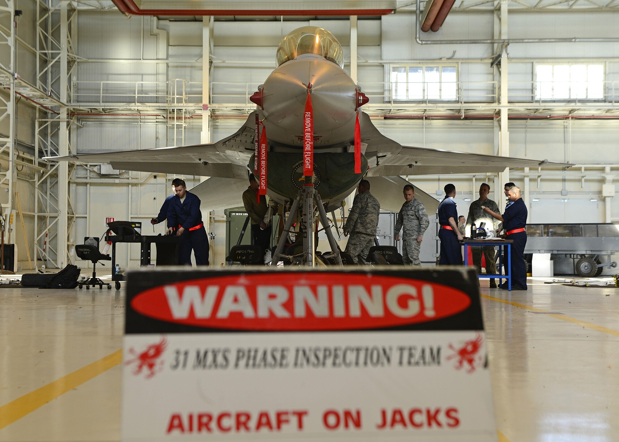 Airmen from the 31st Maintenance Squadron remove and inspect an F-16 Fighting Falcon’s landing gear, Oct. 18, 2017, at Aviano Air Base, Italy. This routine maintenance inspection occurs every six years and the process takes five days to accomplish. (U.S. Air Force photo by Airman 1st Class Ryan Brooks)