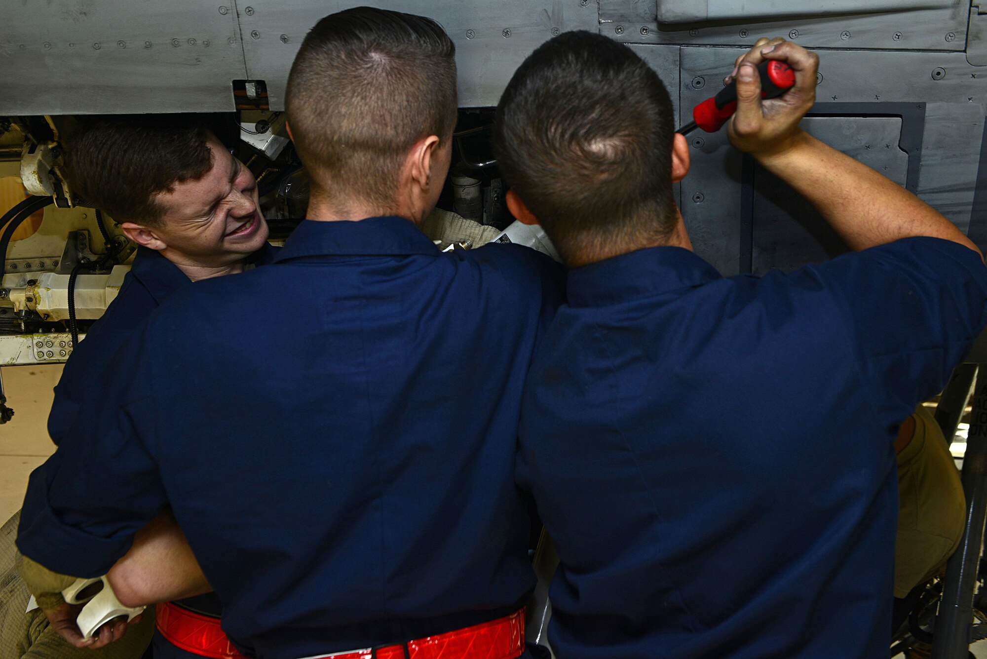 Airmen from the 31st Maintenance Squadron secure a shock strut to an F-16 Fighting Falcon, Oct. 18, 2017, at Aviano Air Base, Italy. This routine maintenance inspection occurs every six years and the process takes approximately five days to accomplish. (U.S. Air Force photo by Airman 1st Class Ryan Brooks)