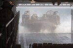 171018-N-OW019-097 U.S 5TH FLEET AREA OF OPERATIONS (Oct. 16, 2017) A landing craft, air cushion (LCAC), operated by Sailors of Assault Craft Unit 5, exits the well deck of the amphibious dock landing ship USS Pearl Harbor (LSD 52) as it prepares to go ashore in support of Iron Magic 18. Iron Magic 18 is a combined-arms live-fire engagement meant to expand levels of cooperation, enhance mutual maritime capabilities, and promote long-term regional stability and interoperability between U.S. forces and regional partners. (U.S. Navy photo by Mass Communication Specialist Seaman Logan C. Kellums/Released)