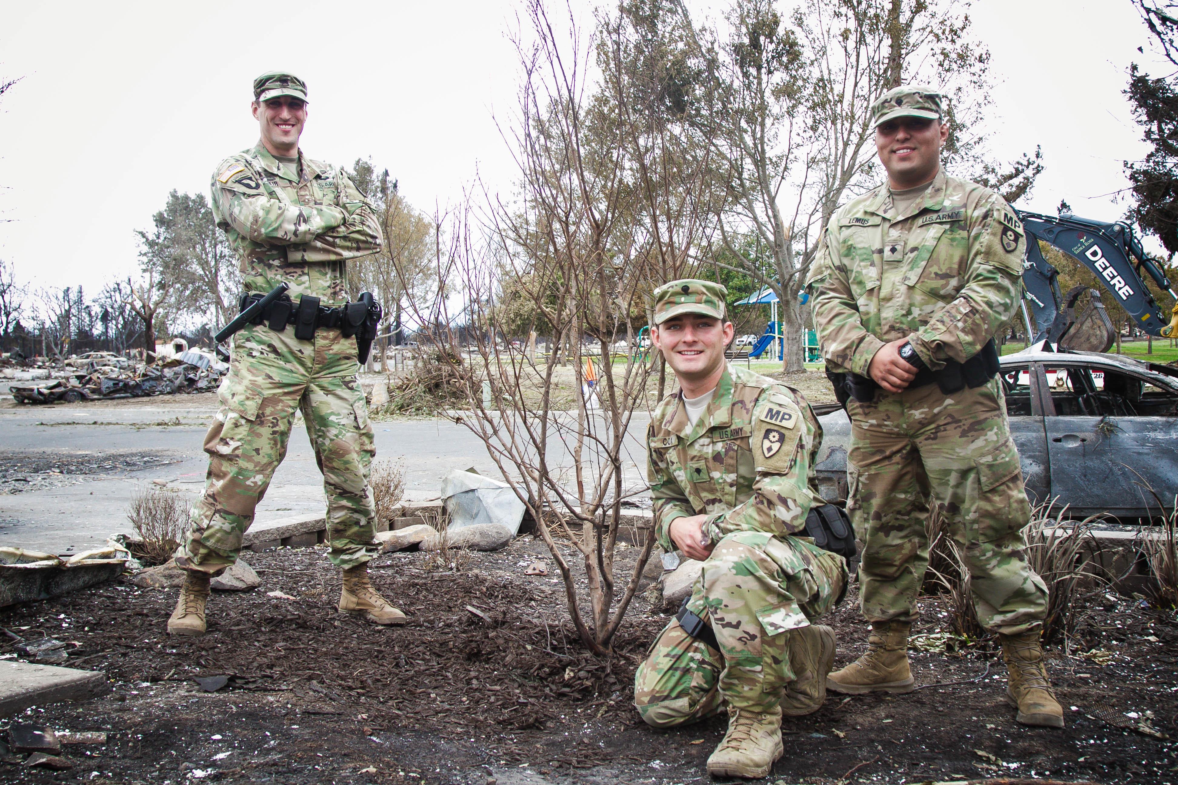 Amid ruins left by wildfire California Guard Soldiers nurture a little