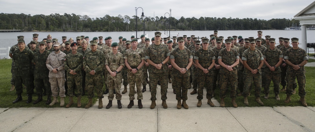 Coalition partners pose for a group photo during a cookout at Camp Lejeune, N.C., Oct. 17, 2017. Bold Alligator 17 is a large-scale, multinational amphibious exercise designed to execute complex shaping operations, amphibious landing and attack, and sea basing operations to improve U.S. and coalition ship-to-shore capabilities. (U.S. Marine Corps photo by Lance Cpl. Leynard Kyle Plazo)