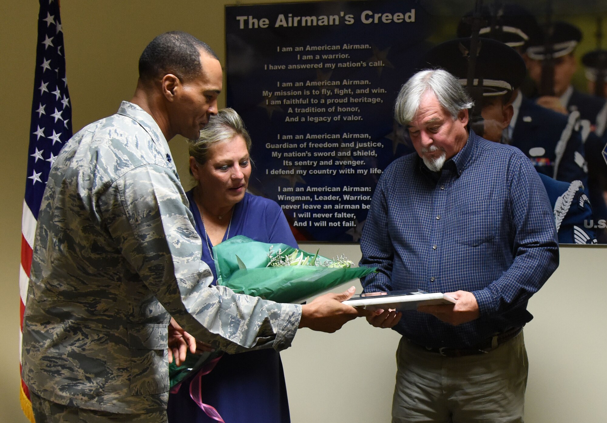 Lt. Col. Billy Wilson, 334th Training Squadron commander, presents Suzi Fernandez and Brent Sibley with plaques during a dedication ceremony to honor their son, Staff Sgt. Forrest Sibley, at Cody Hall Oct. 20, 2017, on Keesler Air Force Base, Mississippi. Sibley was killed in combat in Afghanistan on Aug. 26, 2015. Sibley, a four-time Bronze Star medal recipient, was a combat controller who received his initial technical training from the 334th Training Squadron here. A training room was dedicated in his memory during the event. (U.S. Air Force photo by Kemberly Groue)