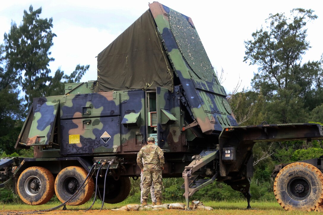 A soldier performs a routine inspection of a patriot radar system during a table gunnery training exercise.