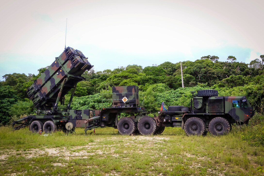 Soldiers prepare a Patriot missile launcher system during a table gunnery training exercise.