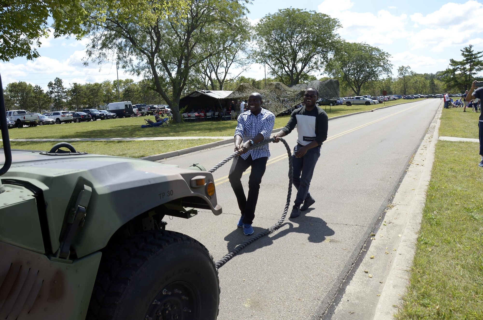 2nd lieutenant Olutola Banjoko, a flight nurse assigned to the 445th Aeromedical Evacuation Squadron, and Senior Airman Omoregie Inneh, 445th Force Support Squadron human resources, participate in the truck pull, held during the 445th Airlift Wing Family Fun Day Sept. 9, 2017. (U.S. Air Force photo/Staff Sgt. Joel McCullough)