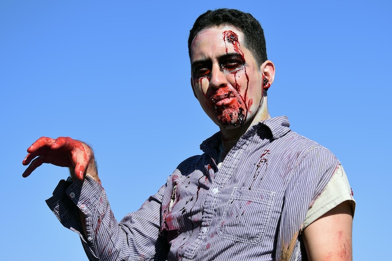 Jiri Rivera shows off his zombie-self during the Zombie Tunnel 5k Fun Run at Cheyenne Mountain Air Force Station, Colorado, Oct. 20, 2017. The run was open to Front Range military members and their families. (U.S. Air Force photo by Airman 1st Class William Tracy)