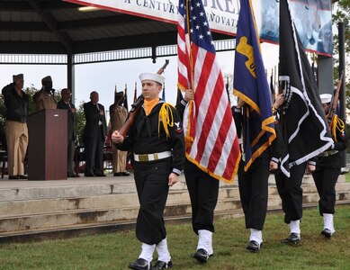 IMAGE: DAHLGREN, Va. (Oct. 16, 2017) – The Aegis Training and Readiness Center Ceremonial Color Guard marches in front of military and civilian personnel gathered with visitors to commemorate the centennial of the Navy base at Dahlgren with a kickoff ceremony. Over the next 12 months, personnel at the base and its tenant commands will join the community to engage in activities such as a science, technology, engineering and mathematics event, a time capsule ceremony, triathlon, spring picnic, concert lunch, historic movie premier, rocket contest, and a grand finale – all in celebration of the centennial.