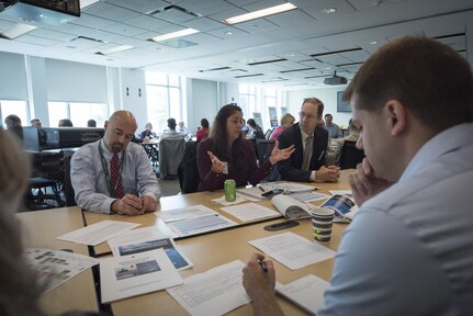 Jen McKee (center) from Naval Surface Warfare Center, Indian Head Explosive Ordnance Disposal Technology Division and other employees from across the Department of the Navy interested in unmanned systems discuss potential test ranges and facilities during the Deputy Assistant Secretary of the Navy for Unmanned Systems Facilities Roadmap workshop at Naval Surface Warfare Center, Carderock Division’s West Bethesda, Maryland, headquarters Sept. 19-20, 2017. (U.S. Navy photo by Monica McCoy/Released)