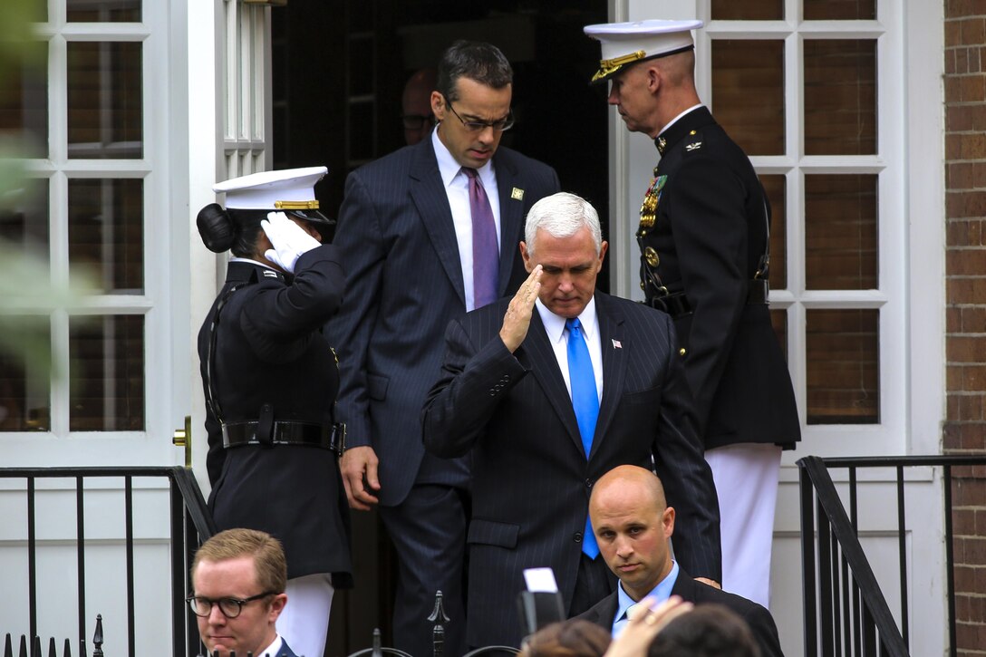 Vice President Mike Pence renders a salute upon departing Center House before the commencement of a Beirut Memorial Parade at Marine Barracks Washington D.C., Oct. 23, 2017. The ceremony was conducted to honor the 34th anniversary of the attack on the U.S. and French Barracks in Beirut and remember the fallen service members, survivors and their families. (Official Marine Corps photo by Lance Cpl. Damon Mclean/Released)