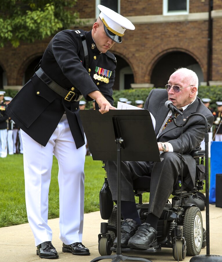 Lieutenant Col. Howard L. Gerlach, U.S. Marine Corps, retired, provides remarks with the assistance of Capt. Alexander Newham, training officer, Marine Barracks Washington D.C., during a Beirut Memorial Parade at the Barracks, Oct. 23, 2017. Gerlach was the commanding officer of 1st Battalion, 8th Marines in 1983 when the terrorist attack occurred. The ceremony was conducted to honor the 34th anniversary of the attack on the U.S. and French Barracks in Beirut and remember the fallen service members, survivors and their families. (Official Marine Corps photo by Lance Cpl. Damon Mclean/Released)