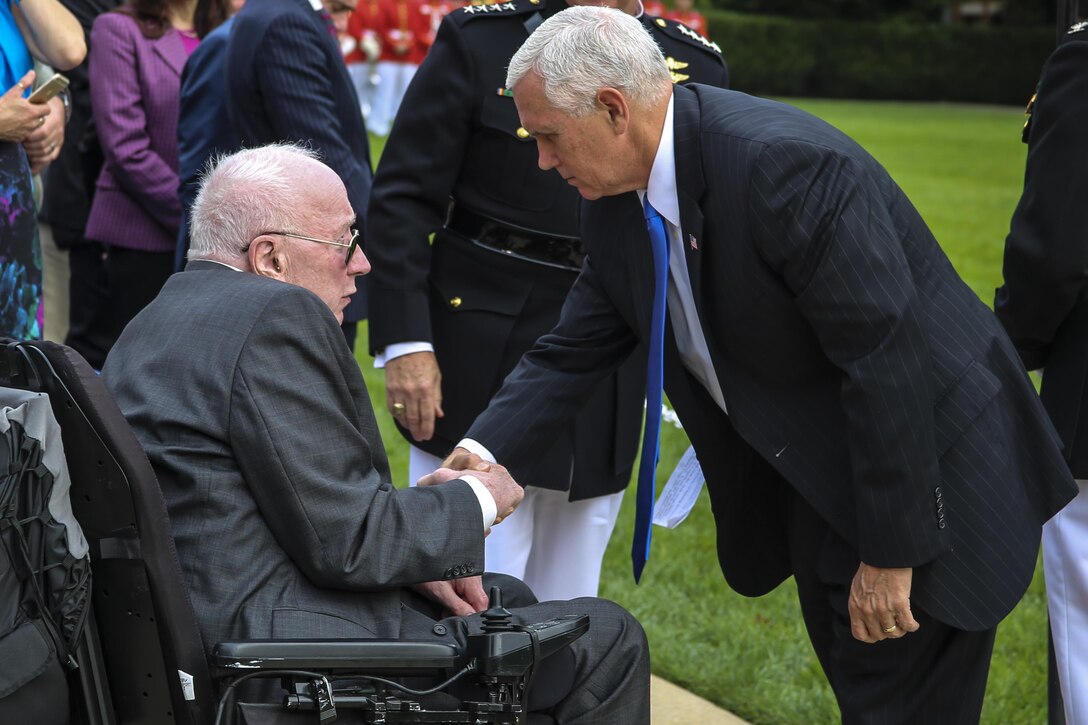 Vice President Mike Pence shakes hands with Lt.Col. Howard L. Gerlach, U.S. Marine Corps, retired, during a Beirut Memorial Parade at Marine Barracks Washington D.C., Oct. 23, 2017. Gerlach was the commanding officer of 1st Battalion, 8th Marines in 1983 when the terrorist attack occurred. The ceremony was conducted to honor the 34th anniversary of the attack on the U.S. and French Barracks in Beirut and remember the fallen service members, survivors and their families. (Official Marine Corps photo by Lance Cpl. Damon Mclean/Released)