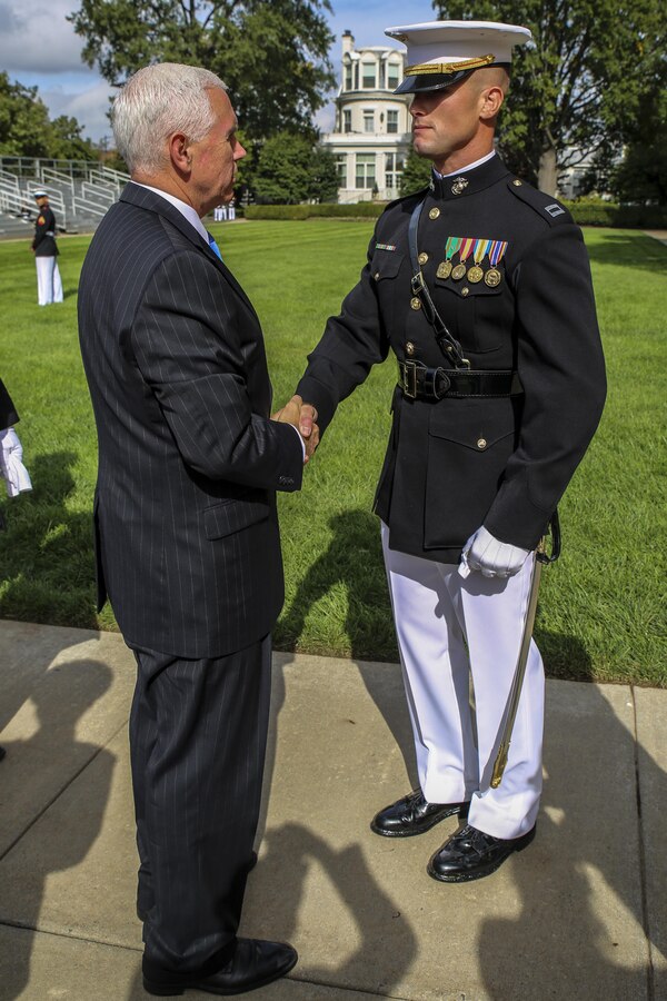 Vice President Mike Pence shakes hands with Capt. Lucas C. Culver, Marine Barracks Washington D.C., after a Beirut Memorial Parade at Marine Barracks Washington D.C., Oct. 23, 2017. The ceremony was conducted to honor the 34th anniversary of the attack on the U.S. and French Barracks in Beirut and remember the fallen service members, survivors and their families. (Official Marine Corps photo by Lance Cpl. Damon Mclean/Released)