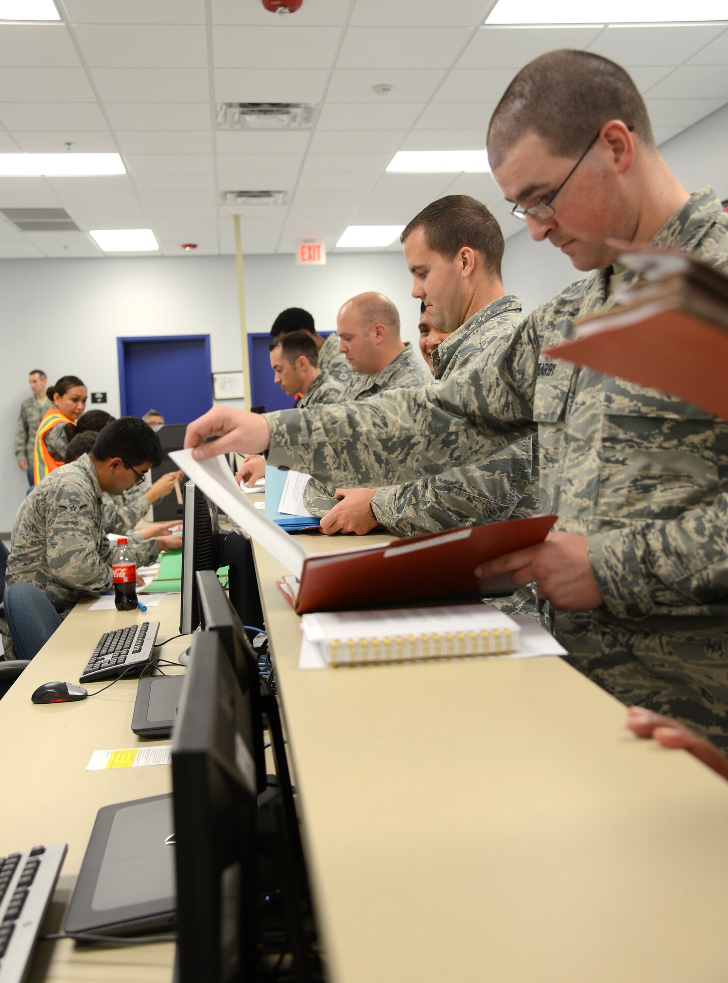 Air Force Materiel Command inspectors, along with Air Force Sustainment Center and 72nd Air Base Wing Inspector General’s offices were on-hand last week, Oct. 4, for an exercise in the deployment processing area of Bldg. 260. Members of the 72nd ABW simulated the process from checking in their C-Bags containing their mission-oriented protective posture gear to inspecting their A-Bags containing their ABU’s, PT gear and hygiene items, for example. After that, the simulated deployers listened to a pre-deployment briefing and then went through the Air Passenger Terminal to check their mobility folders with medical, legal, finance, eligibility, chaplain, services, orders and then passenger manifesting.