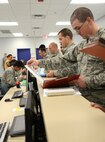 Air Force Materiel Command inspectors, along with Air Force Sustainment Center and 72nd Air Base Wing Inspector General’s offices were on-hand last week, Oct. 4, for an exercise in the deployment processing area of Bldg. 260. Members of the 72nd ABW simulated the process from checking in their C-Bags containing their mission-oriented protective posture gear to inspecting their A-Bags containing their ABU’s, PT gear and hygiene items, for example. After that, the simulated deployers listened to a pre-deployment briefing and then went through the Air Passenger Terminal to check their mobility folders with medical, legal, finance, eligibility, chaplain, services, orders and then passenger manifesting.