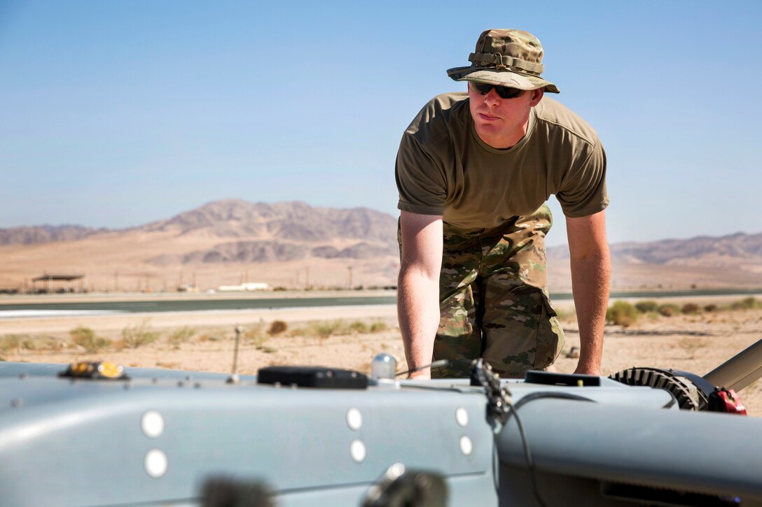 Army Pfc. James Boerema prepares an RQ-7B Shadow for launch during Integrated Training Exercise 1-18.