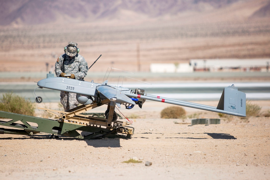 Army Pfc. Austin Henry inspects an RQ-7B Shadow before launch during Integrated Training Exercise 1-18.