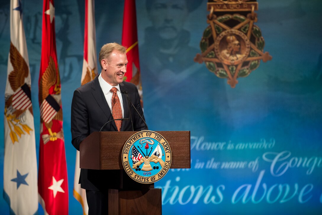 Deputy Defense Secretary Shanahan stands at a podium.