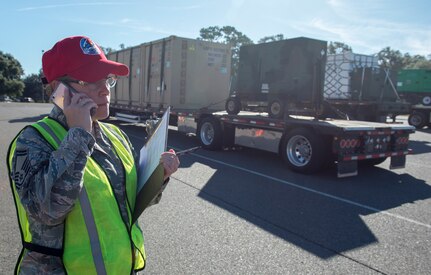 U.S. Air Force Senior Master Sgt. Samantha Davis, 203rd Red Horse material manager, verifies the location of equipment headed to Joint Base Charleston Oct. 20.