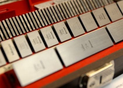 Gauge blocks are aligned in a box at the 3rd Maintenance Squadron Precision Measurement Equipment Laboratory at Joint Base Elmendorf-Richardson, Alaska, Oct. 23, 2017. Gauge blocks are standards JBER uses to establish precision lengths for micrometers and dial calipers. (U.S. Air Force photo/Senior Airman Curt Beach)
