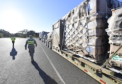 Cargo is inspected as it arrives at an initial staging area here Oct. 20 as part of sustained efforts aiding the rebuilding of Puerto Rico in the wake of Hurricane Maria.