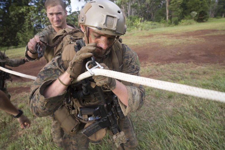 Sgt. Zachary Malik, a student of Recon Team Leaders Course (RTLC), secures himself to a spy-line during an exercise, East Range, Schofield Barracks, Oct. 18, 2017. RTLC is an 8-week advanced joint-service course that takes place in three key geographical regions of operation such as classes at Camp Pendleton, California, desert patrol operations in Yuma, Arizona, and ending with jungle and amphibious exercises across Oahu, Hawaii. (U.S. Marine Corps photo by Lance Cpl. Luke Kuennen)