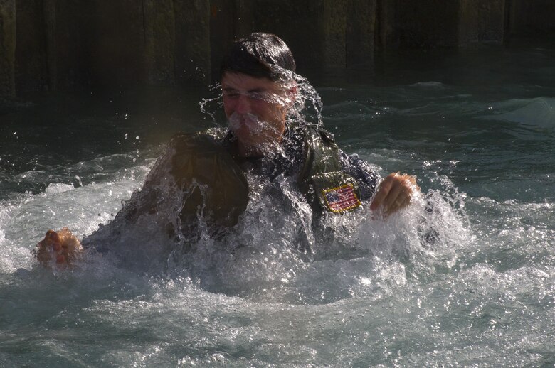 U.S. Navy Hospitalman Spurgeon Crosby, a Recon Team Leaders Course student (RTLC), rehearses a helocasting jump off of the Waterfront Operations pier, Marine Corps Base Hawaii, Oct. 19, 2017. RTLC is an 8-week advanced joint-service course that takes place in three key geographical regions of operation such as classes at Camp Pendleton, California, desert patrol operations in Yuma, Arizona, and ending with jungle and amphibious exercises across Oahu, Hawaii. (U.S. Marine Corps photo by Lance Cpl. Luke Kuennen)