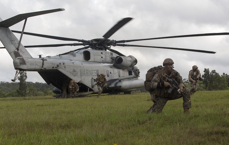 A member of the Recon Team Leaders Course (RTLC) posts security during an aerial insertion, East Range, Schofield Barracks, Oct. 18, 2017. RTLC is an 8-week advanced joint-service course that takes place in three key geographical regions of operation such as classes at Camp Pendleton, California, desert patrol operations in Yuma, Arizona, and ending with jungle and amphibious exercises across Oahu, Hawaii. (U.S. Marine Corps photo by Lance Cpl. Luke Kuennen)