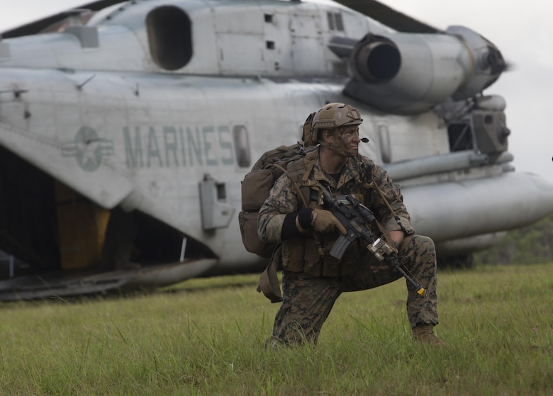 Staff Sgt. Clinton Kuhn, a student of the Recon Team Leaders (RTLC) Course, posts security during an aerial insertion, East Range, Schofield Barracks, Oct. 18, 2017. RTLC is an 8-week advanced joint-service course that takes place in three key geographical regions of operation such as classes at Camp Pendleton, California, desert patrol operations in Yuma, Arizona, and ending with jungle and amphibious exercises across Oahu, Hawaii. (U.S. Marine Corps photo by Lance Cpl. Luke Kuennen)