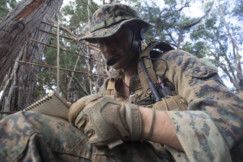 Sgt. Zachary Malik, a student of Recon Team Leaders Course, takes notes during a jungle patrol, East Range, Schofield Barracks, Oct. 18, 2017. RTLC is an 8-week advanced joint-service course that takes place in three key geographical regions of operation such as classes at Camp Pendleton, California, desert patrol operations in Yuma, Arizona, and ending with jungle and amphibious exercises across Oahu, Hawaii. (U.S. Marine Corps photo by Lance Cpl. Luke Kuennen)