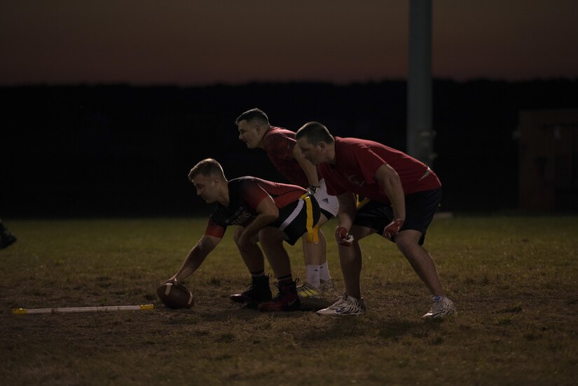 Members from the 30th Intelligence Squadron flag football team prepare for a throw during the 2017 Intramural Flag Football Championship Game at Joint Base Langley Eustis, Va., Oct. 20, 2017.