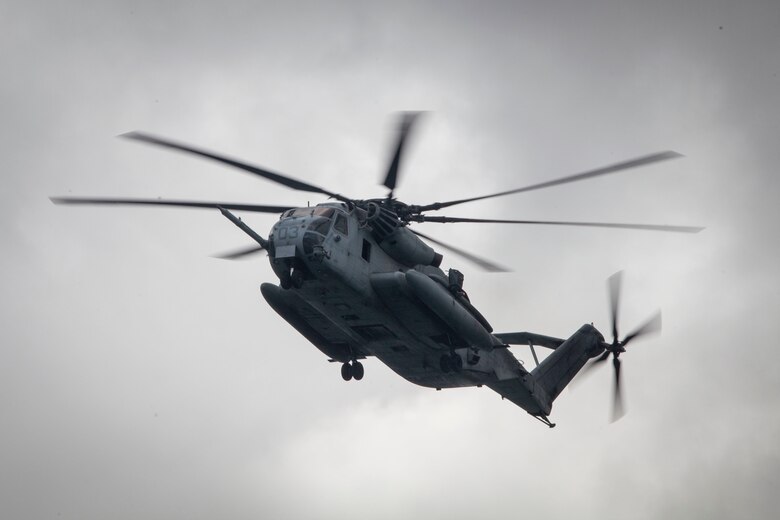 A CH-53E Super Stallion helicopter, assigned to Marine Heavy Helicopter Squadron (HMH) 463, prepares to drop students with the Reconnaissance Team Leader Course (RTLC) during a helocast exercise, Marine Corps Base Hawaii, Oct. 19, 2017. RTLC is an 8-week advanced joint-service course that takes place in three key geographical regions of operation such as classes at Camp Pendleton, California, desert patrol operations in Yuma, Arizona, and ending with jungle and amphibious exercises across Oahu, Hawaii. (U.S. Marine Corps photo by Cpl. Jesus Sepulveda Torres)