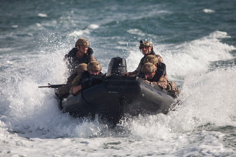 U.S. Service members conduct amphibious water training during a helocast exercise part of the Reconnaissance Team Leader Course (RTLC), Marine Corps Base Hawaii, Oct. 19, 2017. RTLC is an 8-week advanced joint-service course that takes place in three key geographical regions of operation such as classes at Camp Pendleton, California, desert patrol operations in Yuma, Arizona, and ending with jungle and amphibious exercises across Oahu, Hawaii. (U.S. Marine Corps photo by Cpl. Jesus Sepulveda Torres)
