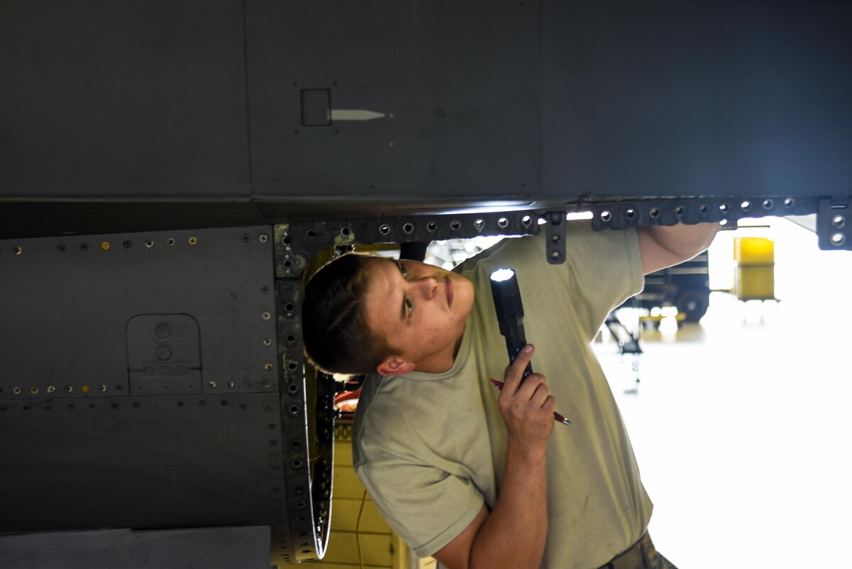 Tech. Sgt. Beau Batscher, 114th Aircraft Maintenance Squadron phase mechanic, inspects an F-16 engine bay during a Phase Inspection Oct. 5, 2017, Joe Foss Field, S.D.