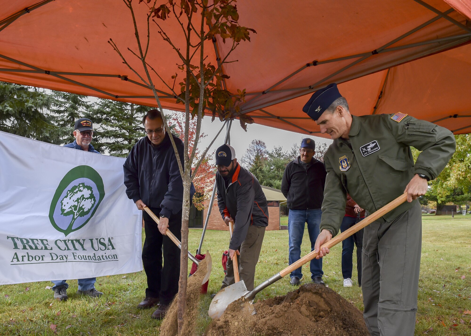 Col. Dan Sarachene, 910th Airlift Wing commander, gives remarks during a tree-planting ceremony here, Oct. 24