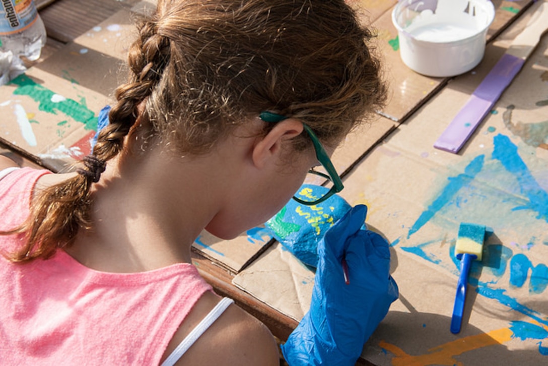 A volunteer paints a “safety rock” as part of Thurmond Lake’s National Public Lands Day event, Sept. 30. The rocks are being placed around Thurmond’s public areas for visitors to find and share on social media.