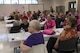 Attendees listen to speakers during a Pink and Purple Luncheon, Oct. 19, 2017, at Moody Air Force Base, Ga. The luncheon was designed to raise awareness about breast cancer and encourage everyone to speak-up about domestic violence. (U.S. Air Force photo by Senior Airman Janiqua P. Robinson)