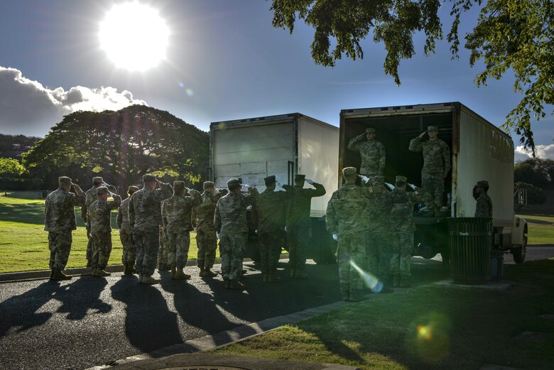 Servicemembers with the Defense POW/MIA Accounting Agency honor the fallen during a disinterment ceremony Aug. 28, 2017, at the National Memorial Cemetery of the Pacific in Honolulu, Hawaii. The remains disinterred will be transferred to the DPAA laboratory for identification. (U.S. Air Force photo by Senior Airman Mikaley Kline)