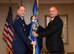 Air Force Sustainment Center Commander Lt. Gen. Lee K. Levy II exchanges the flag with Dennis D’Angelo, the new director for the 448th Supply Chain Management Wing, in a formal Change of Leadership ceremony Oct. 17 at the Tinker Club.
